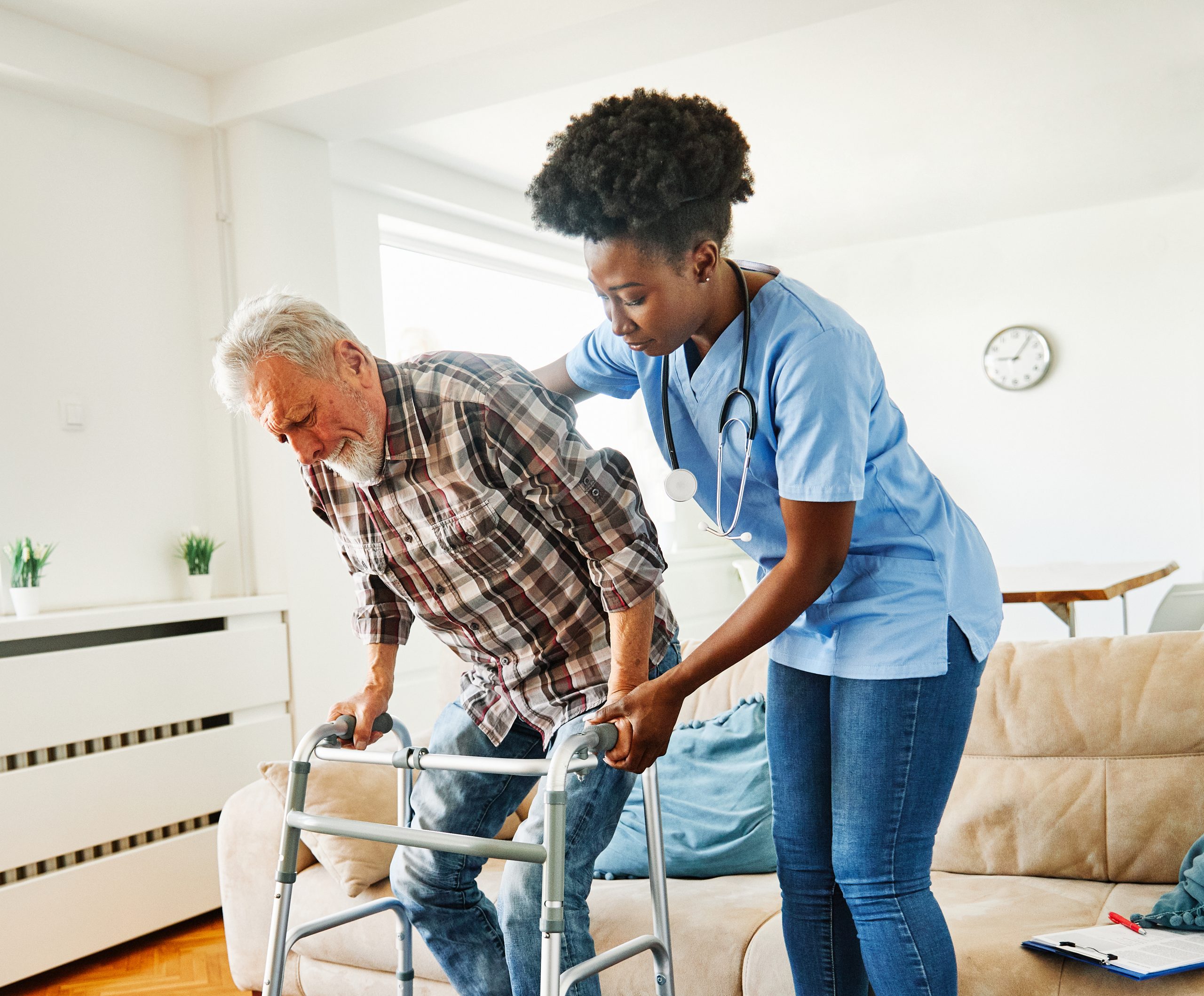 Personal care assistant helping elderly patient