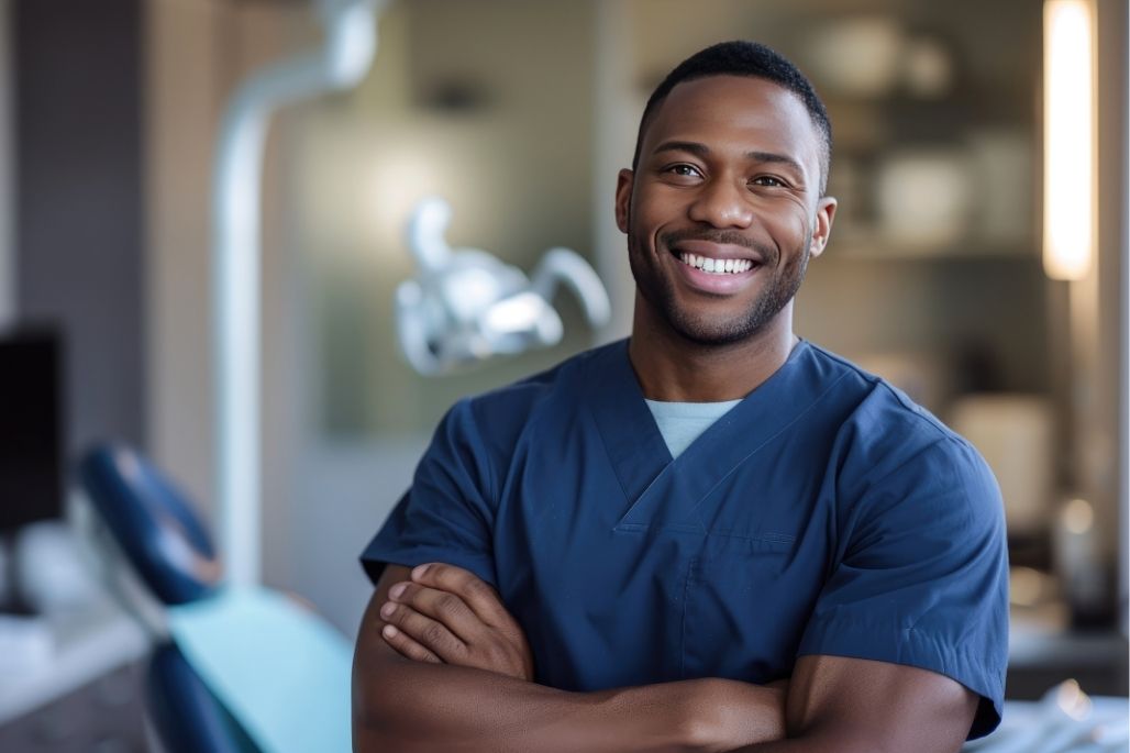 Medical assistant talking with a patient in a clinic.