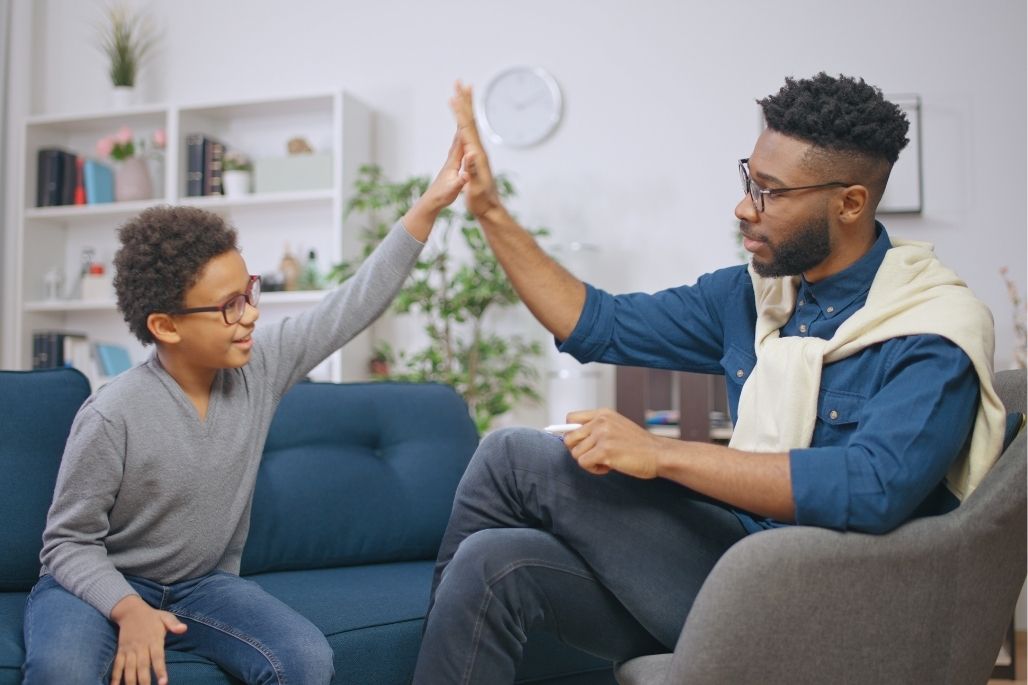 Mental health support professional counseling a patient in an office.